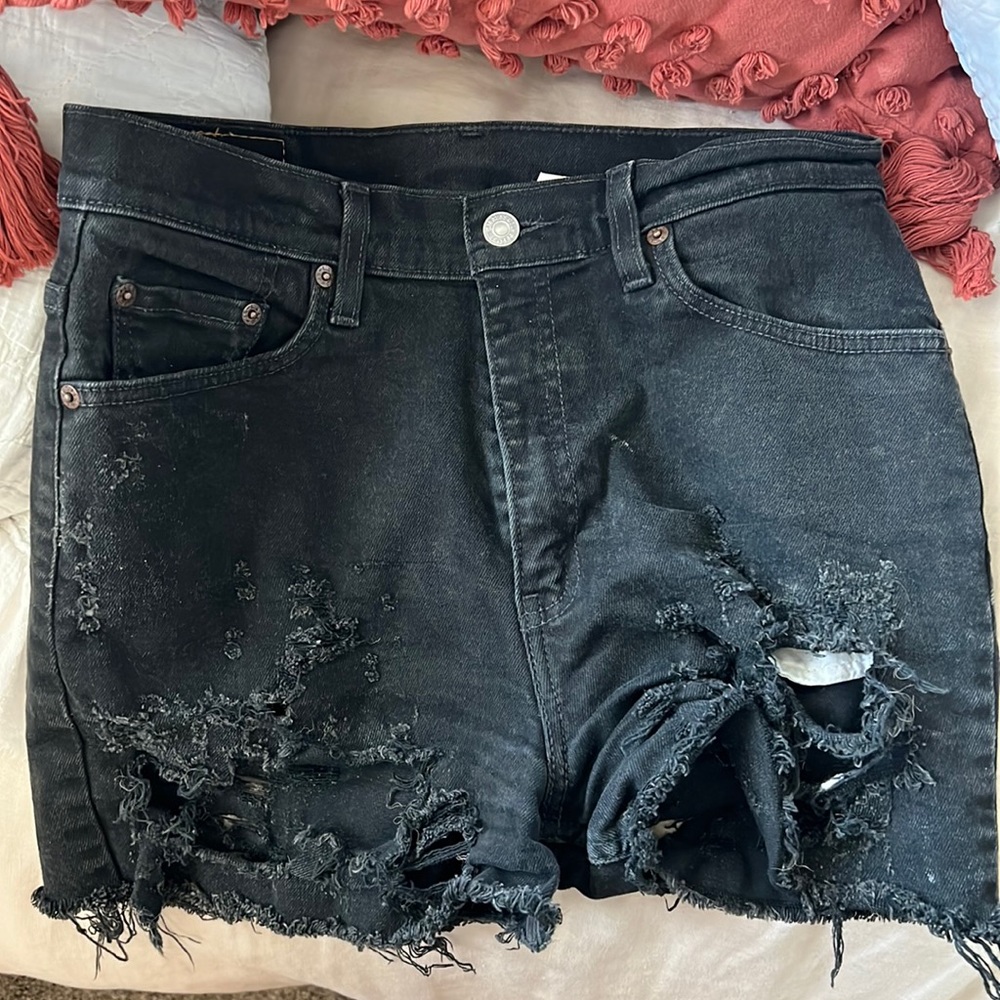 Distressed high waisted black Levi’s vintage denim shorts